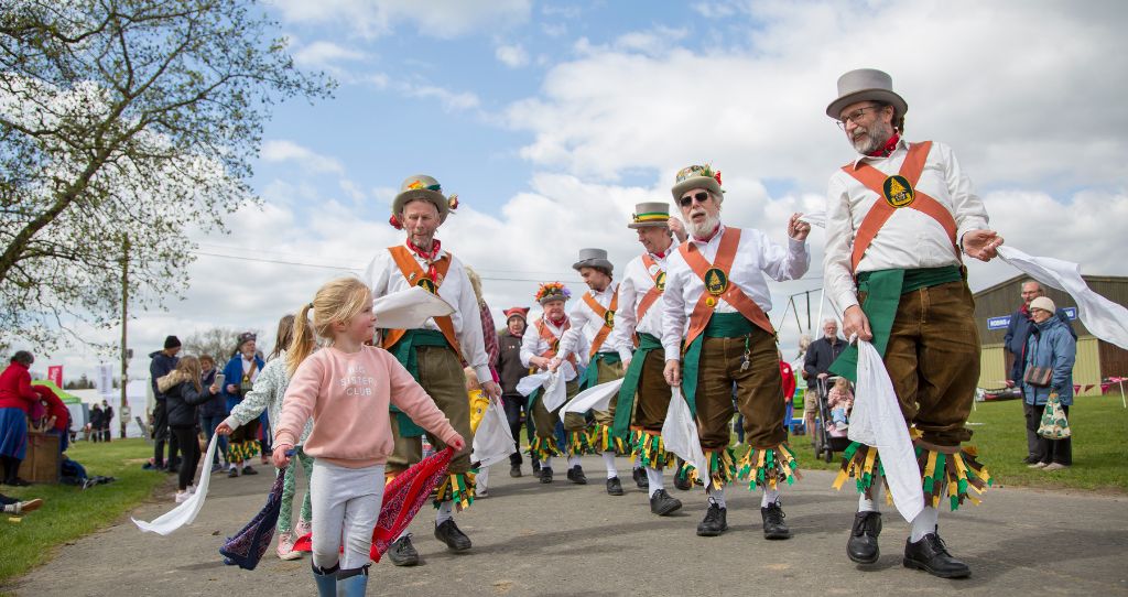 Spring Live! show with Morris dancers dancing with a little girl 