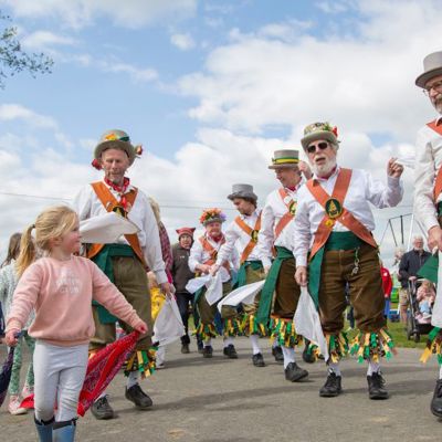 Spring Live! show with Morris dancers dancing with a little girl 