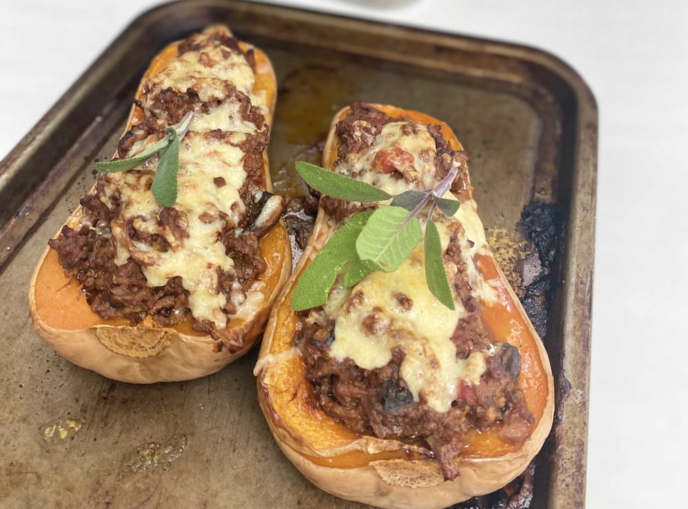 Baked butternut squash stuffed with beef and cheese