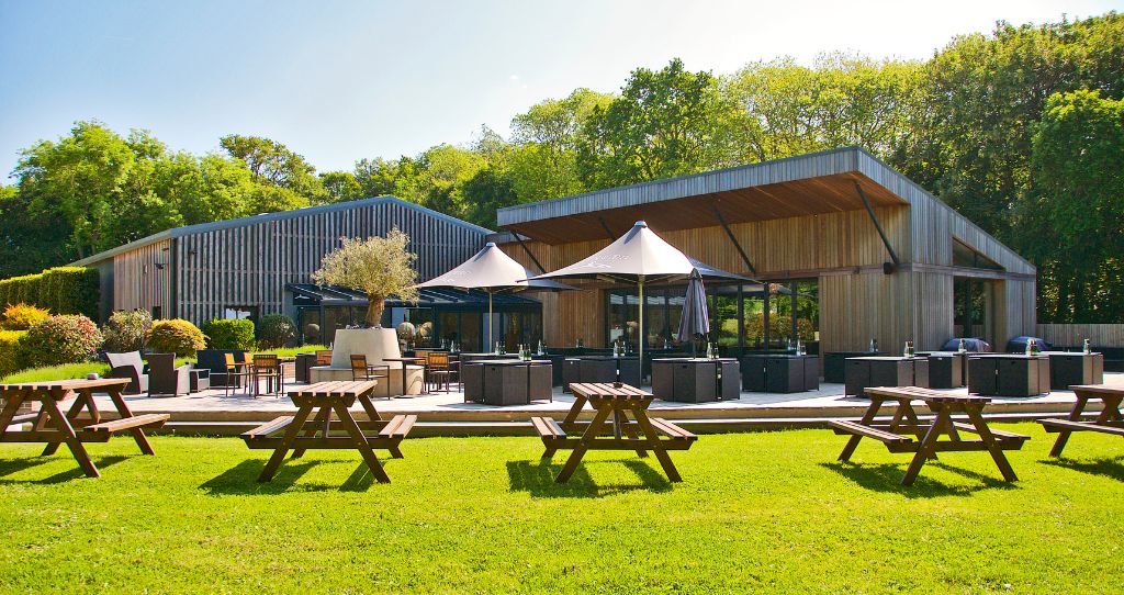 Tinwood Estate bar with picnic benches and umbrellas